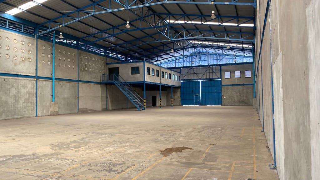 An empty warehouse floor, swept and waiting for whoever takes it next.