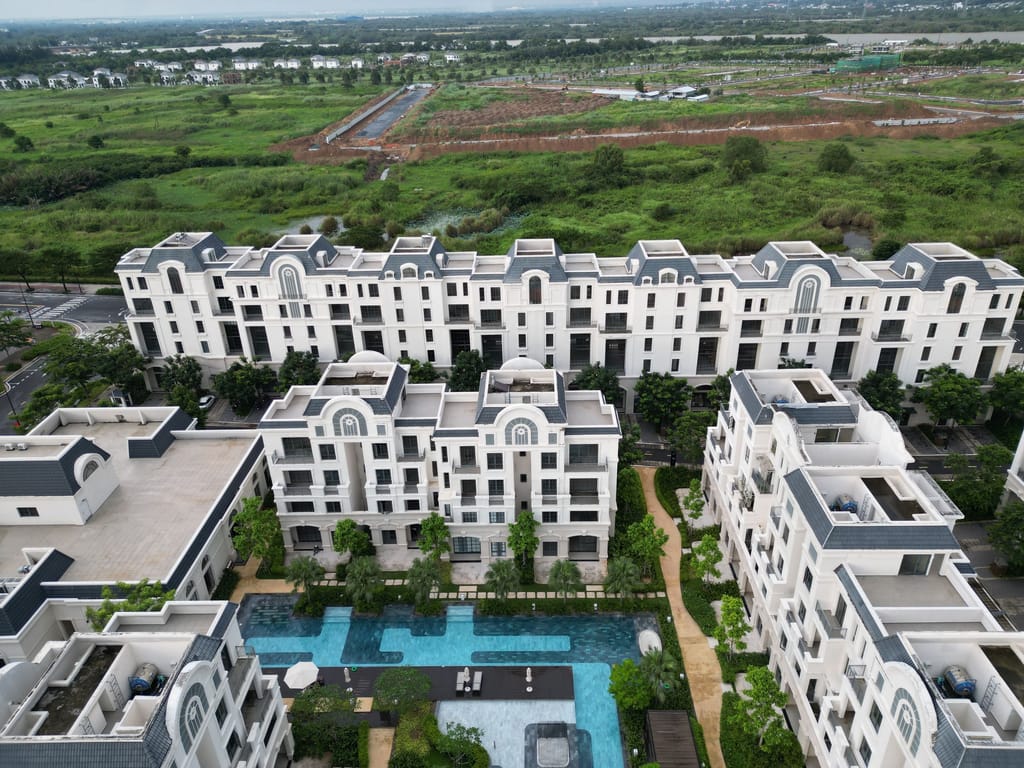 Apartment blocks seen from above, courtyards and rooftops laid out below.